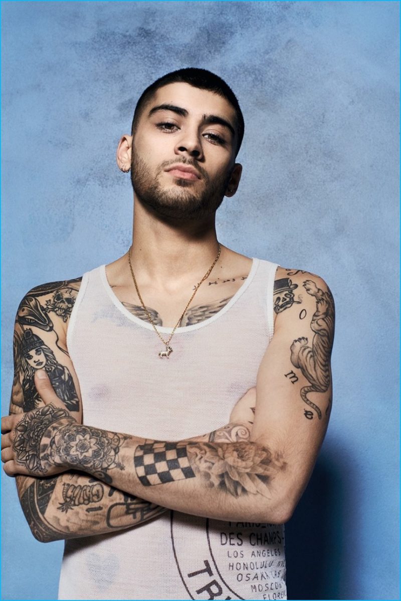 Zayn Malik dons a Louis Vuitton mesh tank.