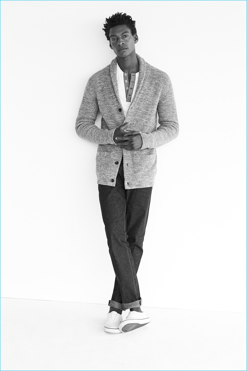 Ty Ogunkoya embraces smart style in a shawl neck cardigan sweater and jeans for Abercrombie & Fitch's fall 2016 denim campaign.