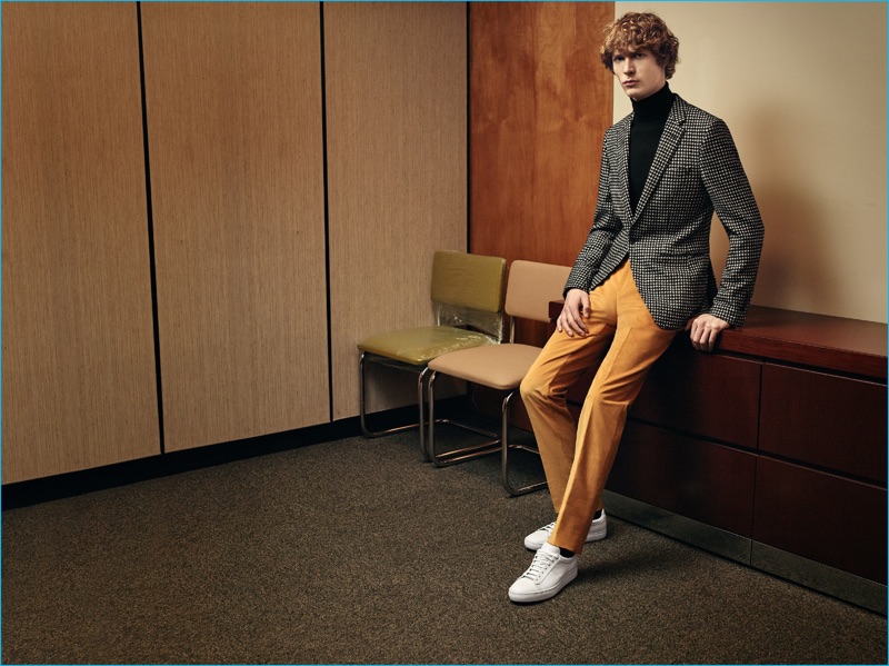 Sven de Vries sports a pop of color with a pair of orange trousers from BOSS' fall-winter 2016 collection.