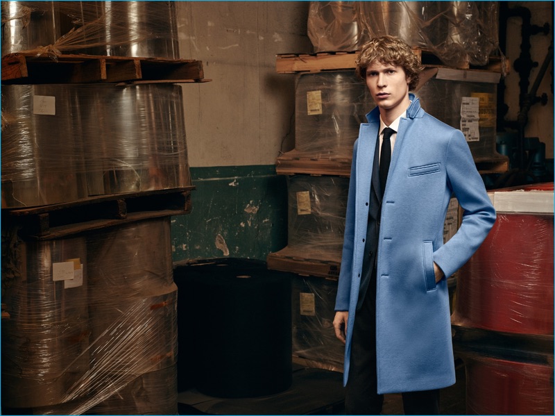 Sven de Vries dons a light blue car coat from BOSS' fall-winter 2016 collection.