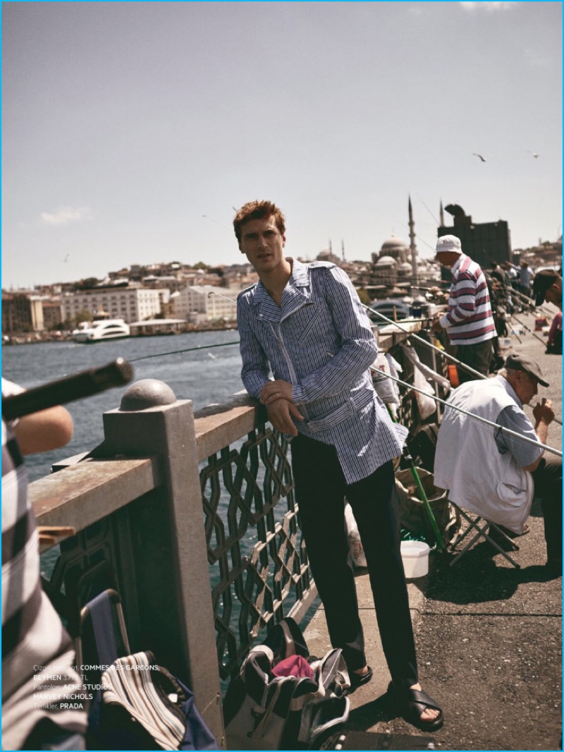 Clément Chabernaud poses for a picture in a Commes des Garçons jacket.