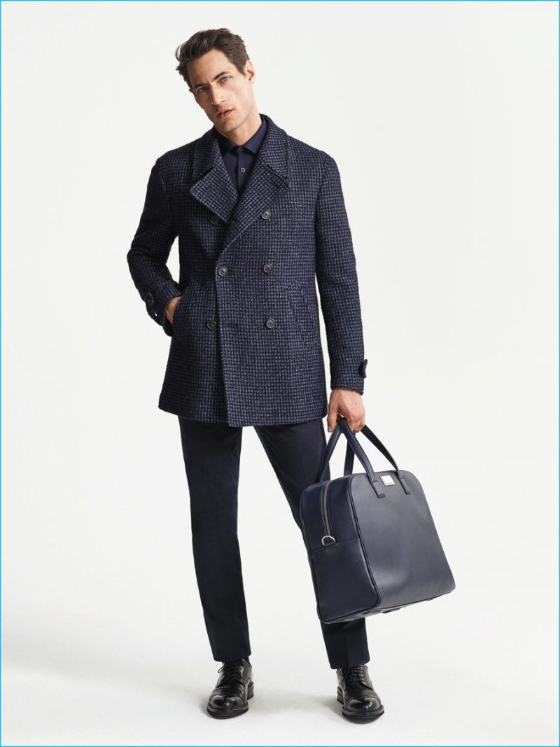 Axel Hermann sports a double-breasted coat from Corneliani's fall-winter 2016 collection. 