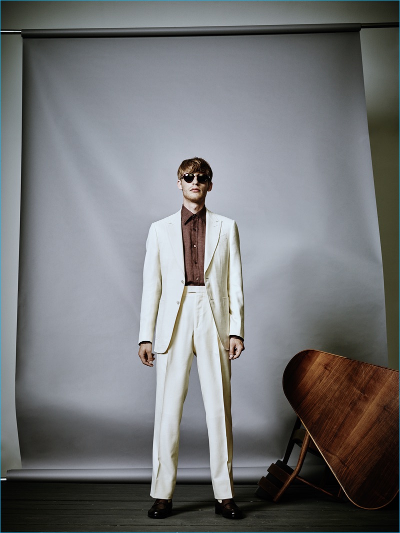 Ermenegildo Zegna does summer suiting with a pristine ivory look, paired with a tobacco brown shirt.