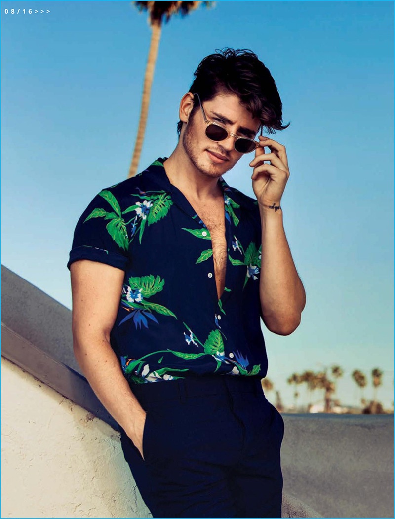 Gregg Sulkin pictured in a tropical print shirt from Sandro.