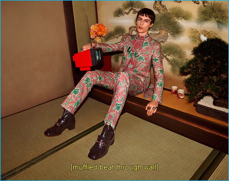 Jack Chambers dons a floral print suit for Gucci's fall-winter 2016 campaign.