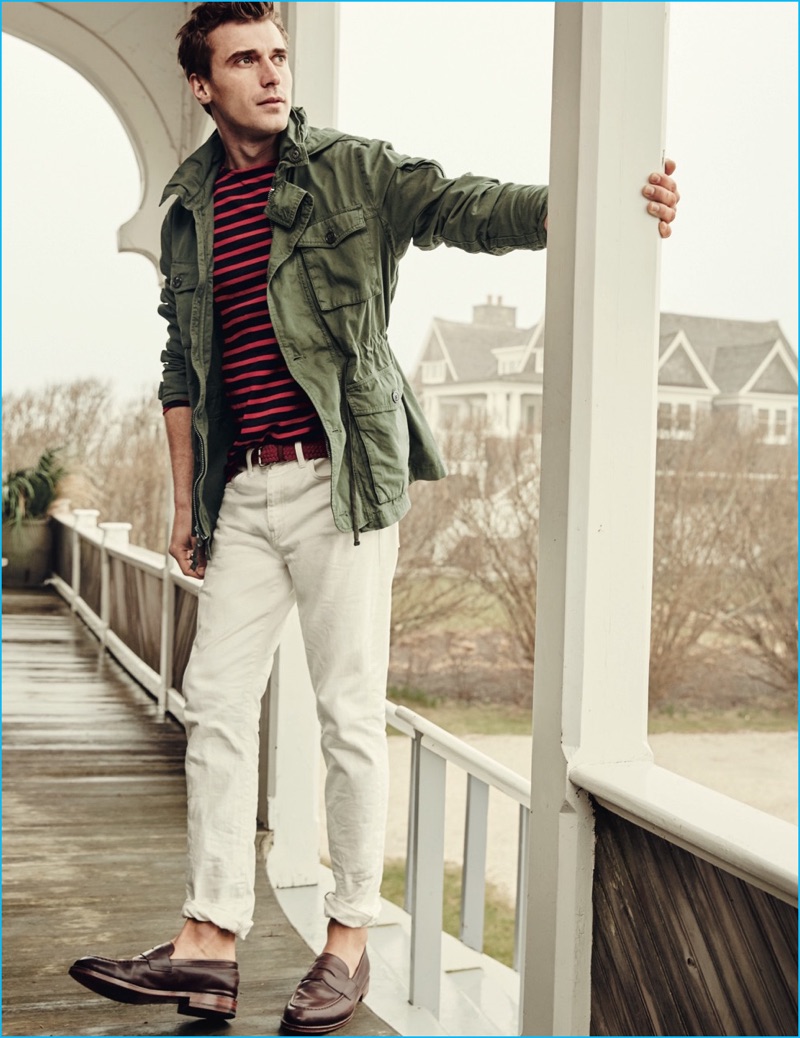 Clément Chabernaud channels a military ease in J.Crew's mechanic field jacket, white 770 jeans, Ludlow penny loafers and Saint James for J.Crew unisex Meridien II nautical t-shirt.