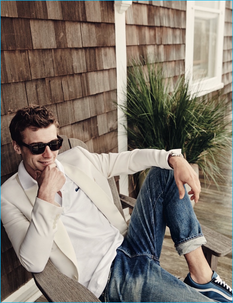 Clément Chabernaud champions smart casual style, wearing a Lacoste for J.Crew polo shirt with a smart tailored blazer and distressed denim jeans.