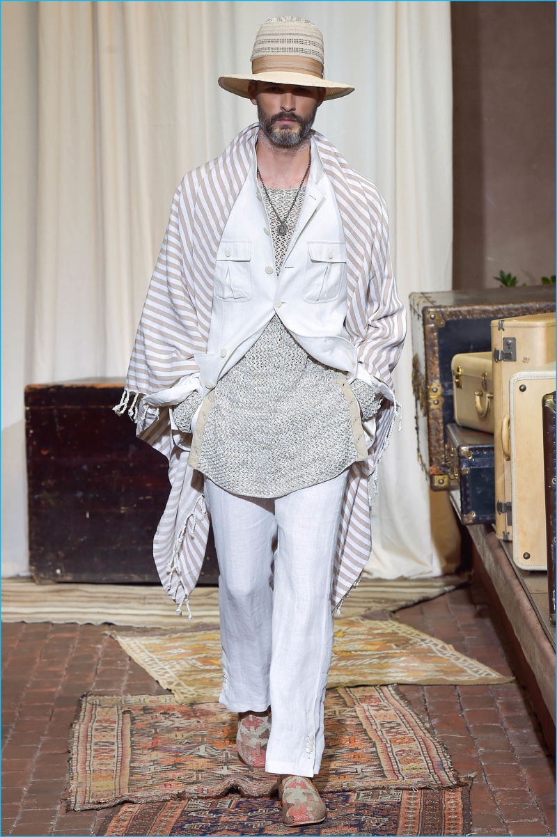 Ben Hill charms in a straw fedora from milliner Albertus Swanepoel as he takes to the runway in a soft, safari-inspired look from Joseph Abboud's spring-summer 2017 collection.