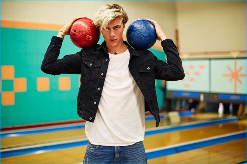 Posing with bowling balls, Lucky Blue Smith is photographed by Nate Hoffman for H&M magazine.