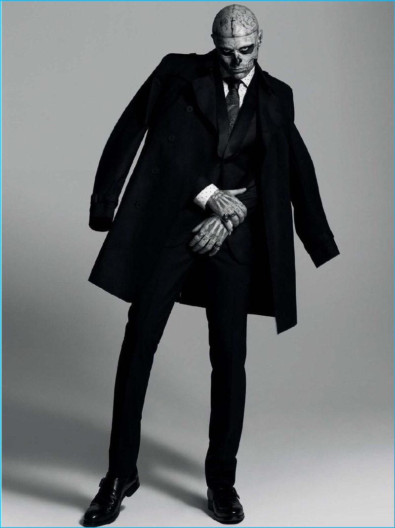 Rick Genest pictured in a Hugo Boss trench coat and trousers with a J.Lindeberg blazer.