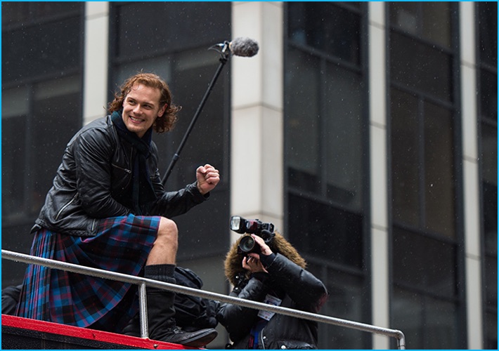 April 2016: Sam Heughan wears a tartan kilt as the grand marshall of 2016's Tartan Day Parade in New York City.