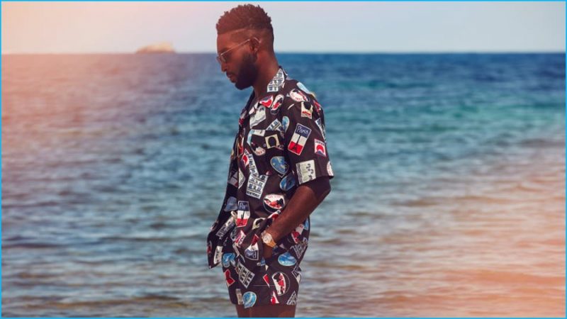 Tinie Tempah wears camp-collar printed shirt and swim shorts Maison Kitsuné.