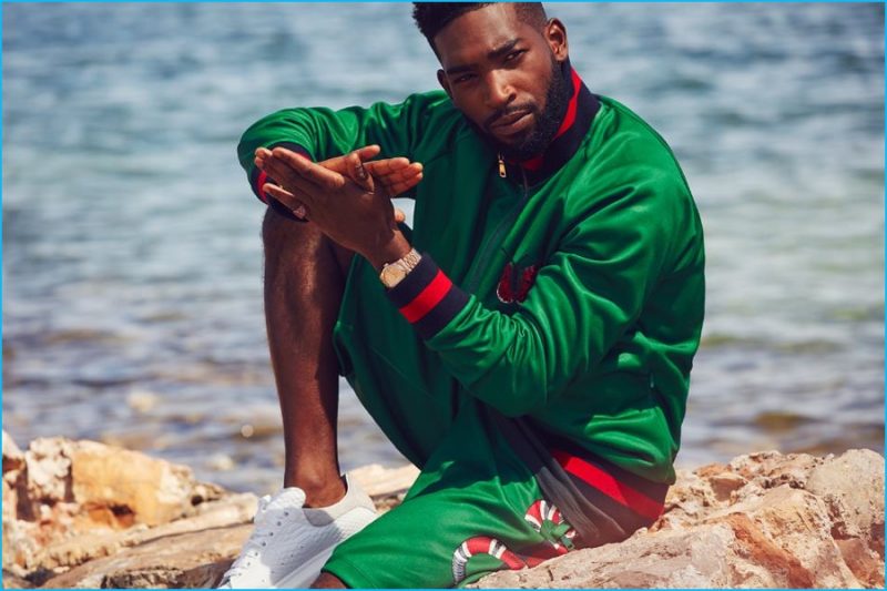 Tinie Tempah wears a Gucci appliquéd tech-jersey zip-up sweatshirt and shorts with Alexander McQueen sneakers.
