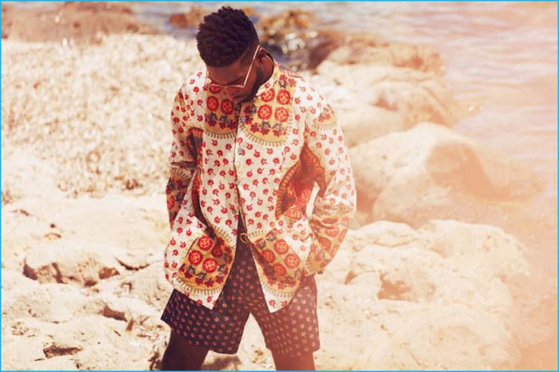 Tinie Tempah wears reversible granddad-collar printed shirt, floral print cotton shorts and GG logo belt Gucci.