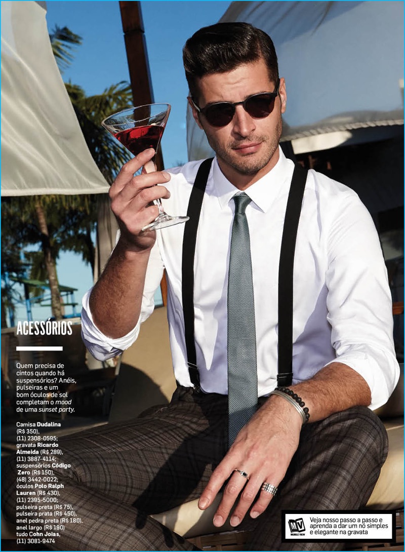 Leandro Lima enjoys a cocktail poolside, making a case for suspenders from Codigo Zero.
