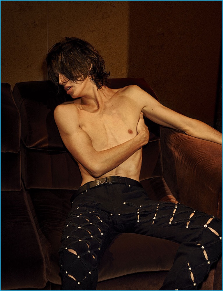 Lucas Satherley goes shirtless in a pair of laser cut jeans for Versus Versace's fall-winter 2016 campaign.