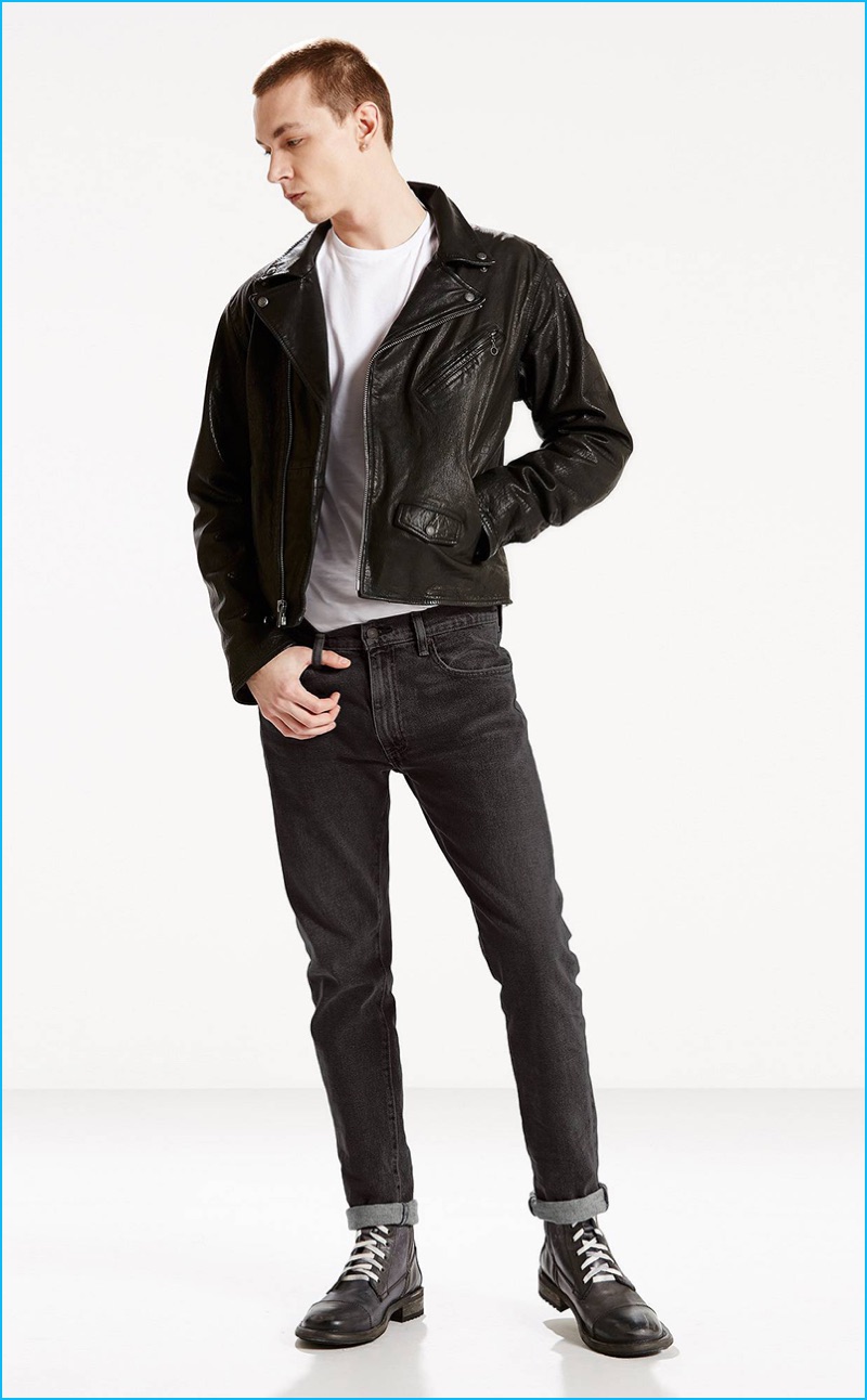 Yuri Pleskun models Levi's 505C Deedee slim fit jeans with a leather biker jacket.