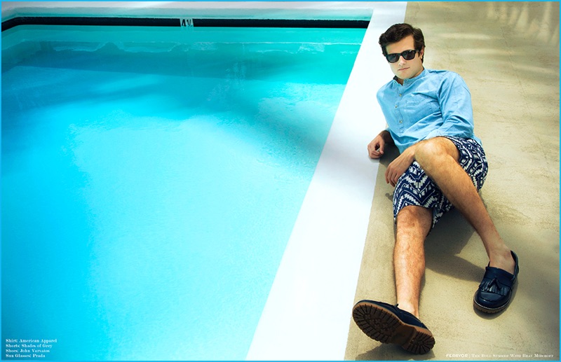 Beau Mirchoff relaxes poolside in printed Shades of Grey shorts with an American Apparel shirt, John Varvatos leather loafers and Prada sunglasses.