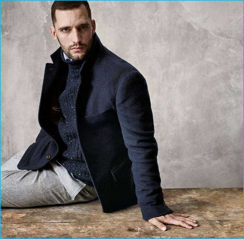 Model Thomaz de Oliveira sports navy fashions from Brunello Cucinelli's fall-winter 2016 collection.