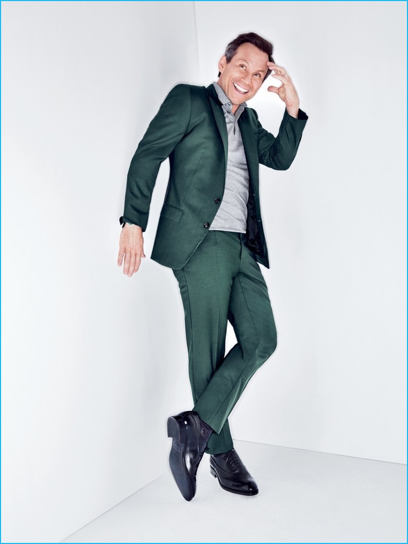 Christian Slater charms in a green Dolce & Gabbana suit for GQ.