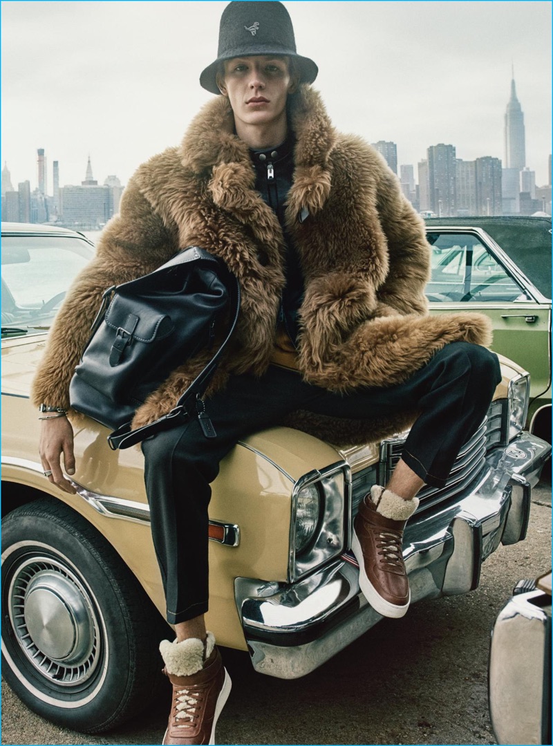Model Finnlay Davis rocks a bucket hat and shearling coat for Coach's fall-winter 2016 advertising campaign.