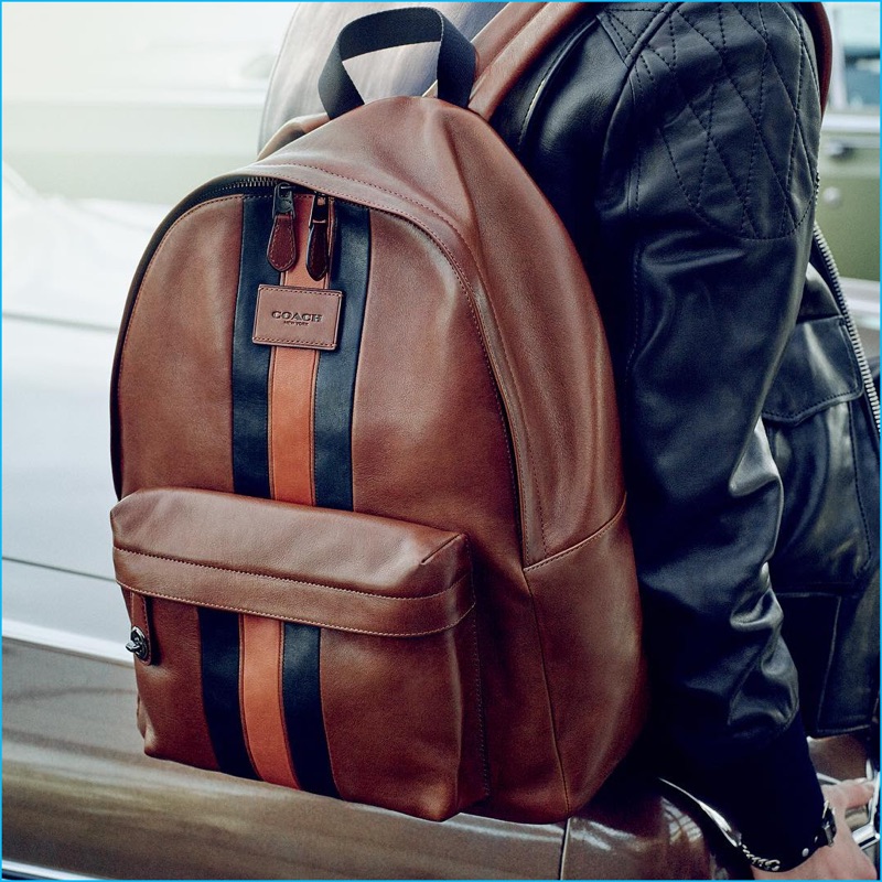 Coach fall-winter 2016 men's advertising campaign featuring the brand's varsity leather backpack.