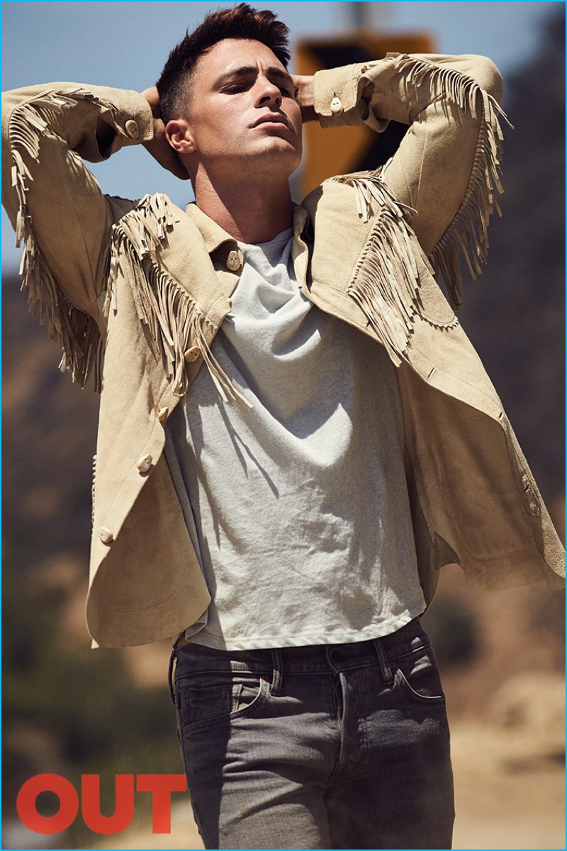Colton Haynes ventures outdoors, wearing a suede fringe shirt jacket from Ralph Lauren Purple Label with Tom Ford denim jeans and a John Varvatos t-shirt.