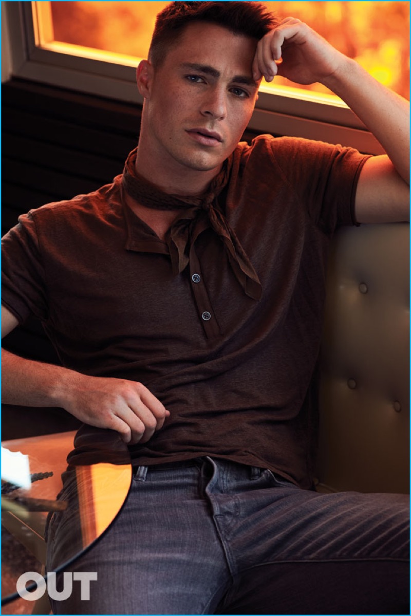 Colton Haynes sports a John Varvatos short sleeve henley shirt with Tom Ford denim jeans.