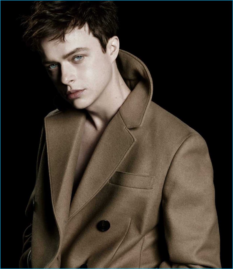 Dane DeHaan dons a sharp coat as the star of Prada L'Homme's fragrance campaign.