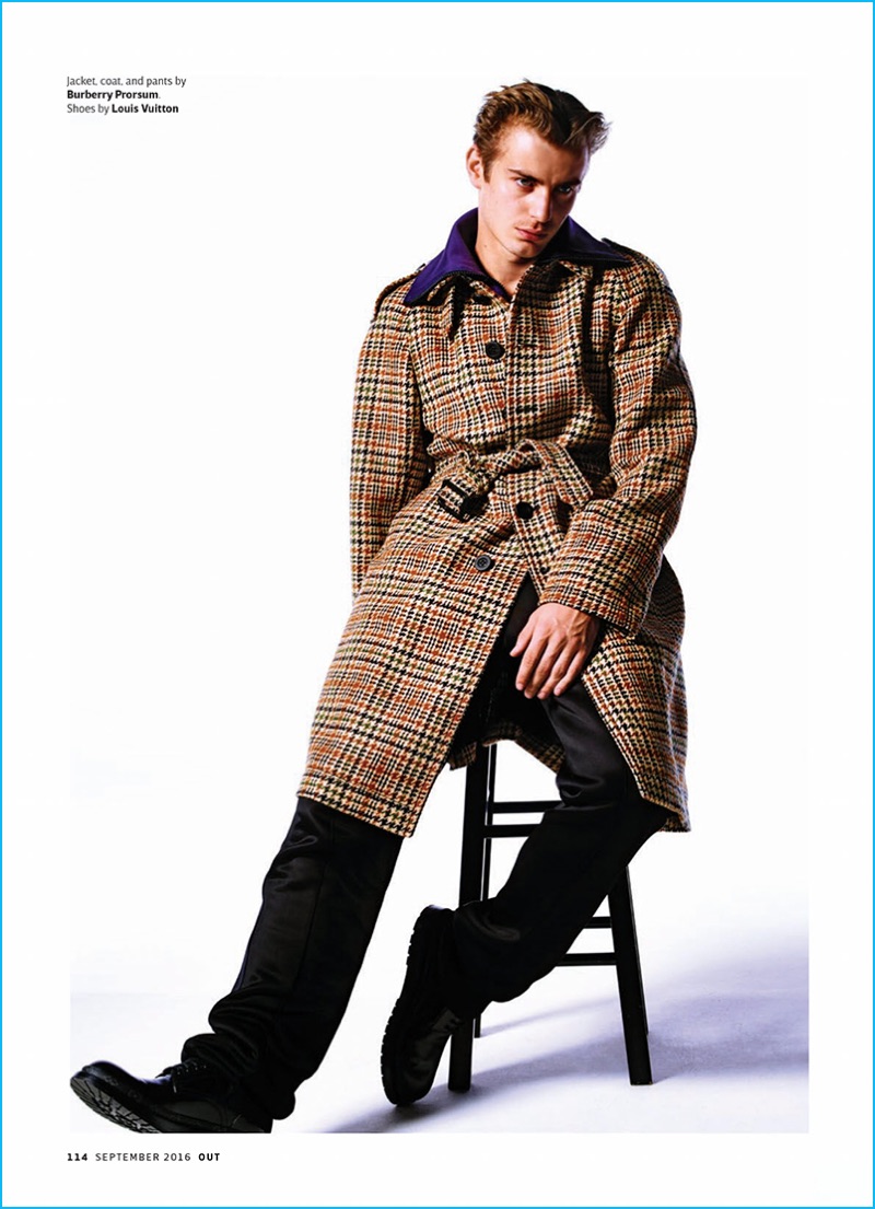 Ben Allen dons an oversized houndstooth coat from British brand Burberry.