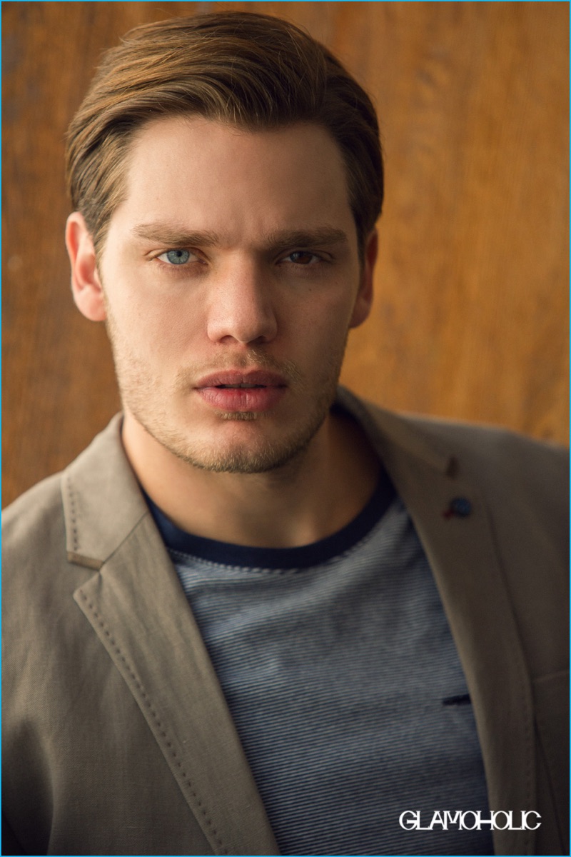 Dominic Sherwood appears in a photo shoot for Glamoholic, wearing a look from Ted Baker.