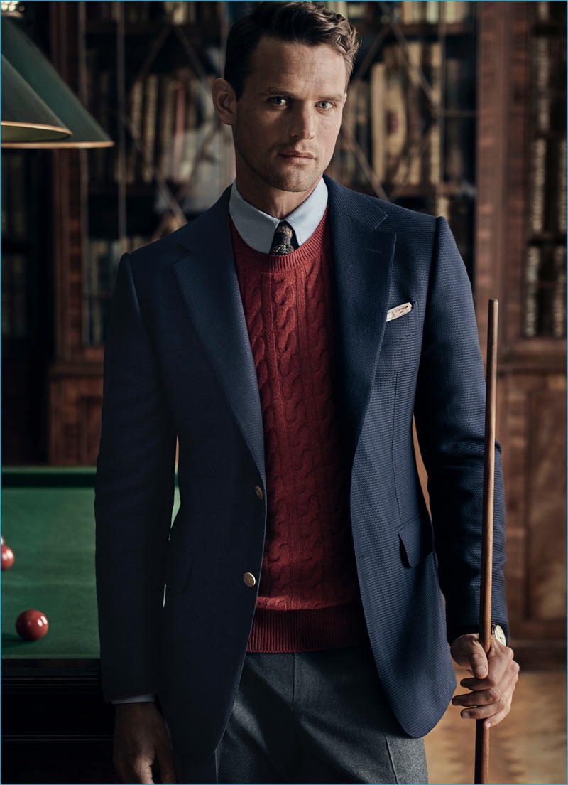 Guy Robinson fronts Dunhill's fall-winter 2016 campaign, donning a sport coat over a cashmere cable knit sweater.