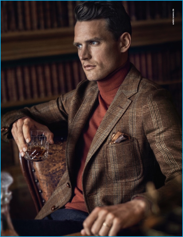 Starring in Dunhill's fall-winter 2016 campaign, Guy Robinson channels English country style in a plaid sport coat and turtleneck.