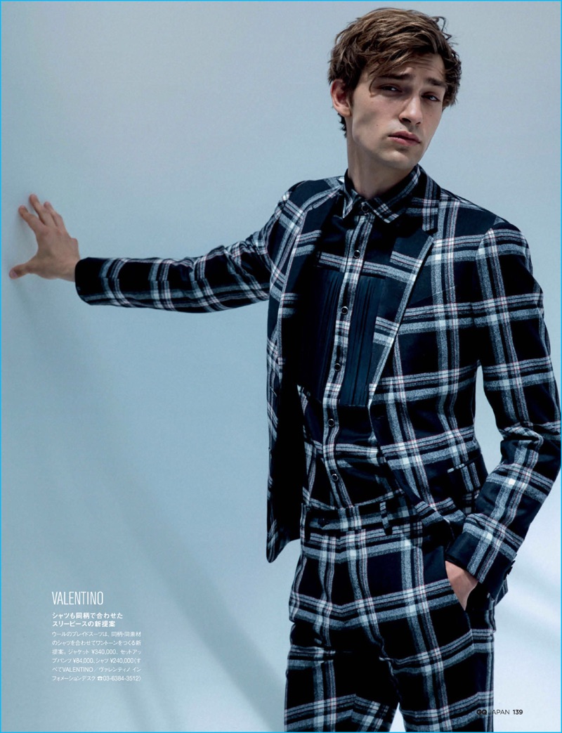 George Le Page models a tartan print suit from Valentino for GQ Japan.