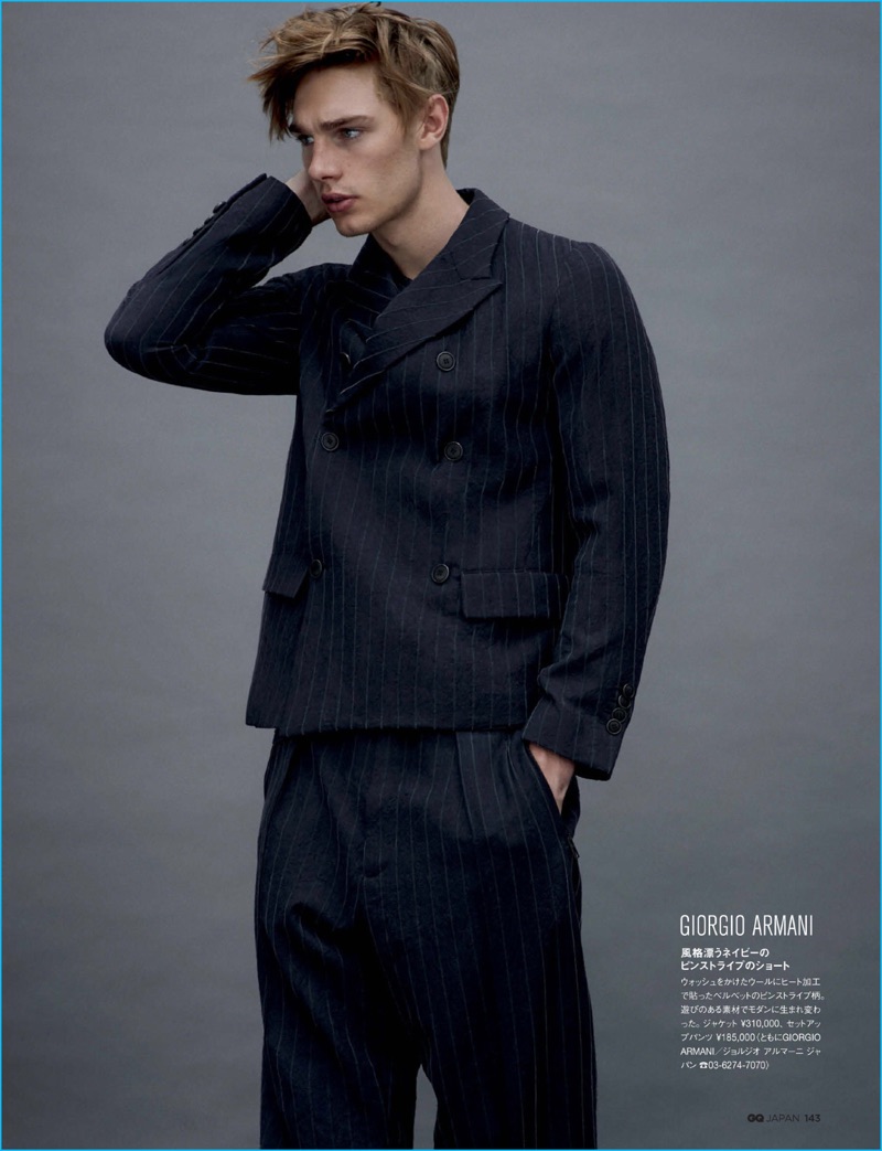 Tommy Marr sports a pinstripe double-breasted suit from Giorgio Armani for GQ Japan.