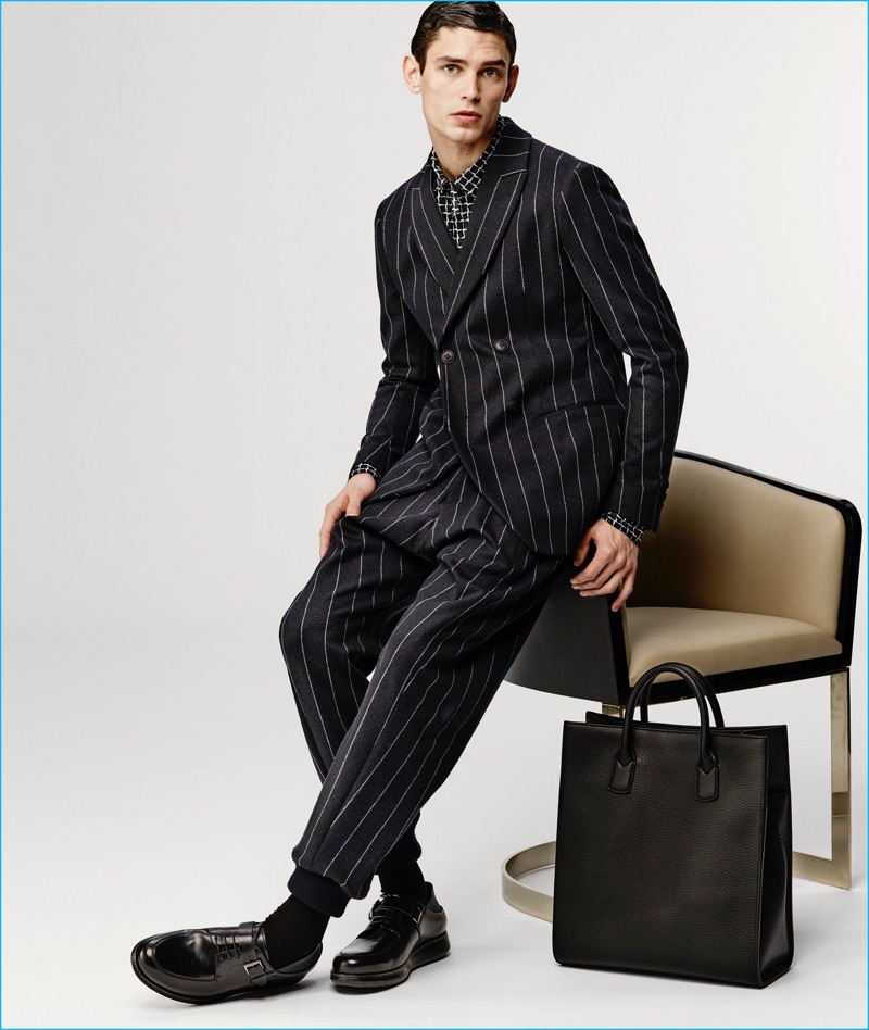 Arthur Gosse dons a pinstripe suit from Giorgio Armani's fall-winter 2016 collection.