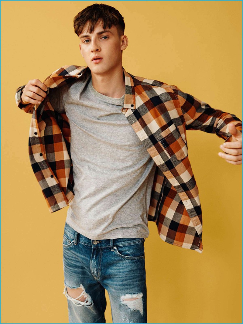H&M Divided embraces casual style with a flannel shirt and distressed denim jeans.