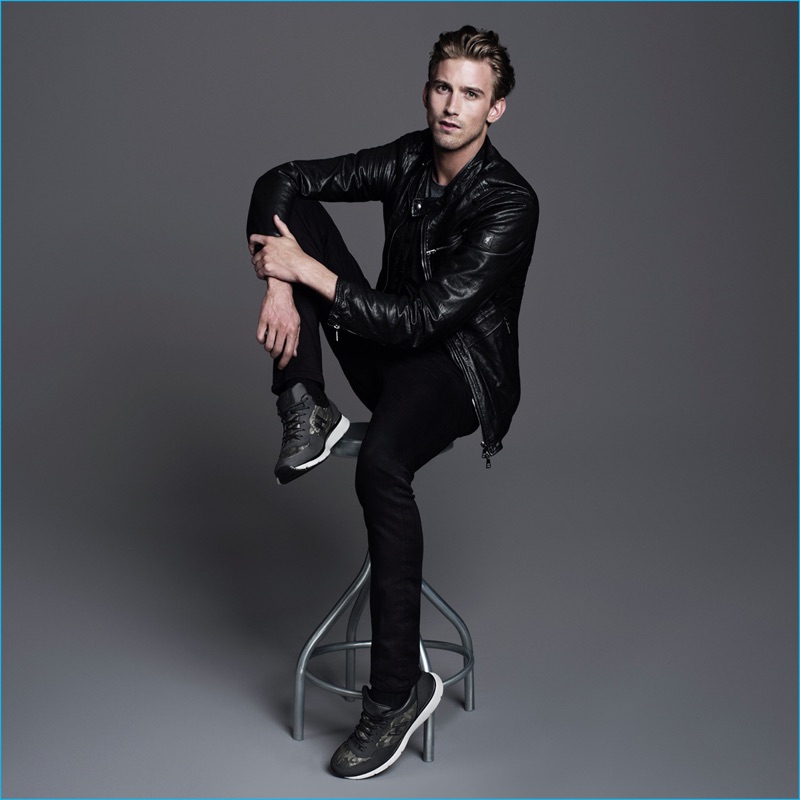 RJ King rocks Hogan sneakers with a leather jacket for the brand's fall-winter 2016 campaign.