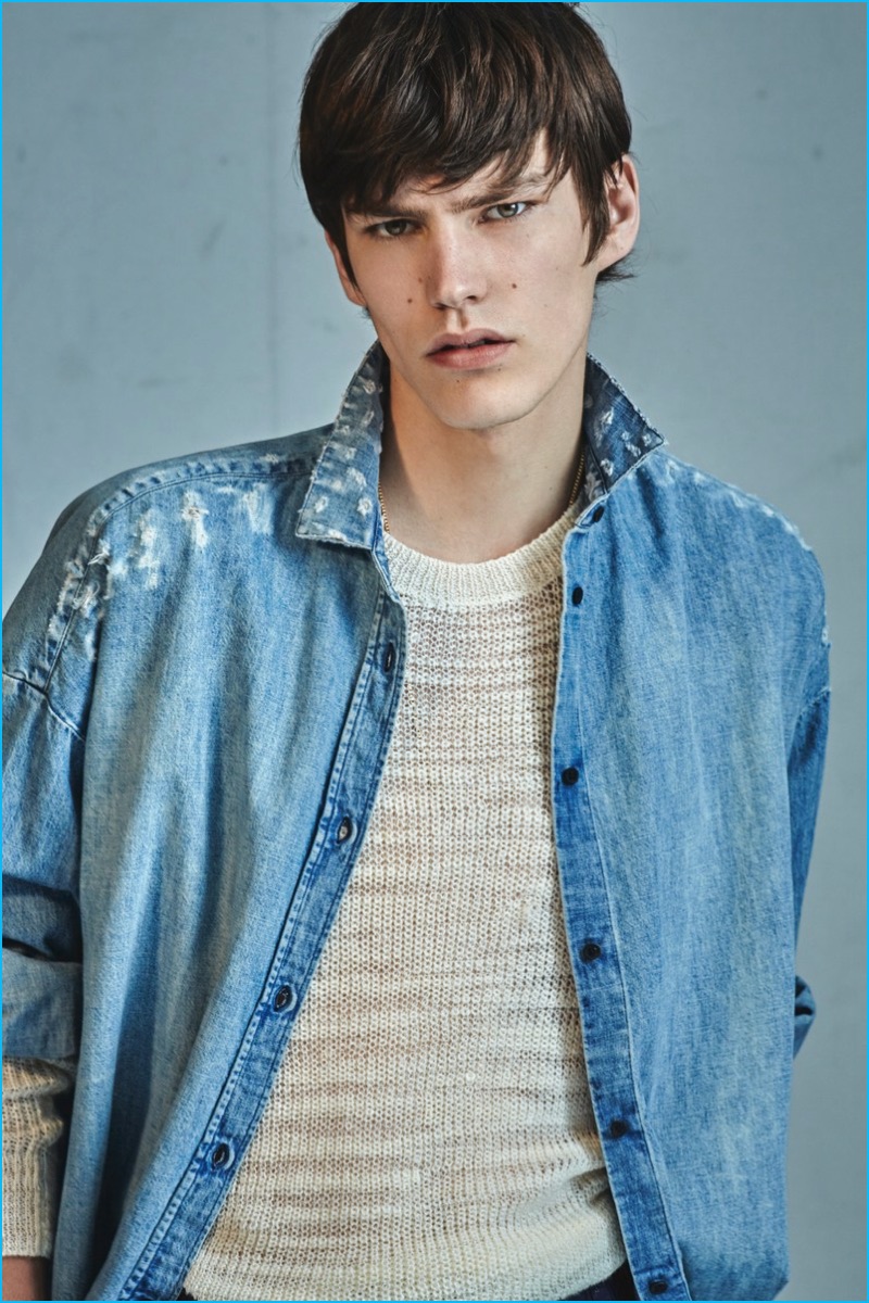 Elias de Poot is pictured in a distressed denim shirt from IRO's fall-winter 2016 collection.