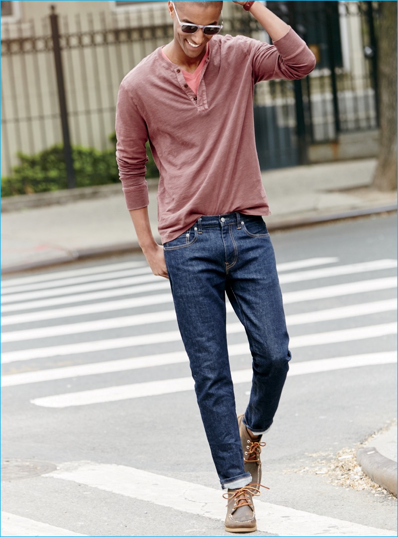 Claudio Monteiro takes to the streets in a henley, v-neck and denim jeans from J.Crew.