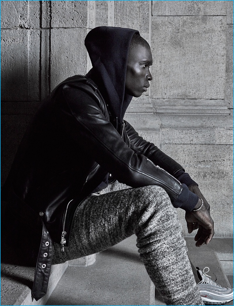 Fernando Cabral rocks joggers with a leather jacket and hoodie from John Elliott's fall-winter 2016 collection.