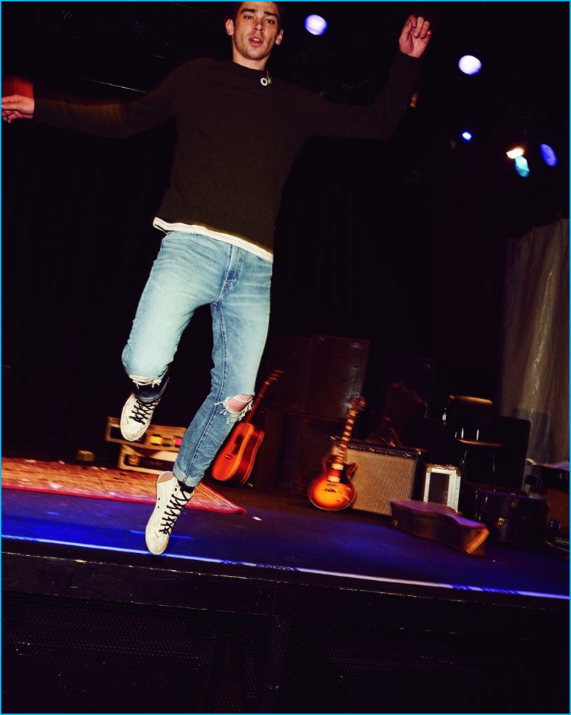 Cole Mohr jumps off the stage, wearing Levi's 505C Joey slim fit denim jeans.