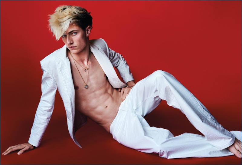 Lucky Blue Smith wears a white leather suit from Kenzo.