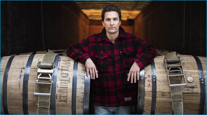 Sporting a red buffalo check shirt jacket, actor Matthew McConaughey promotes Wild Turkey Bourbon.