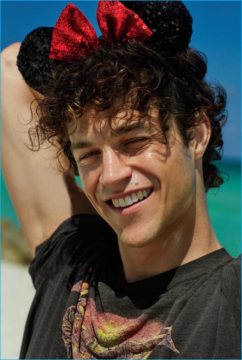 Miles McMillan is all smiles as he rocks Minnie Mouse ears for his The Daily magazine beach shoot.