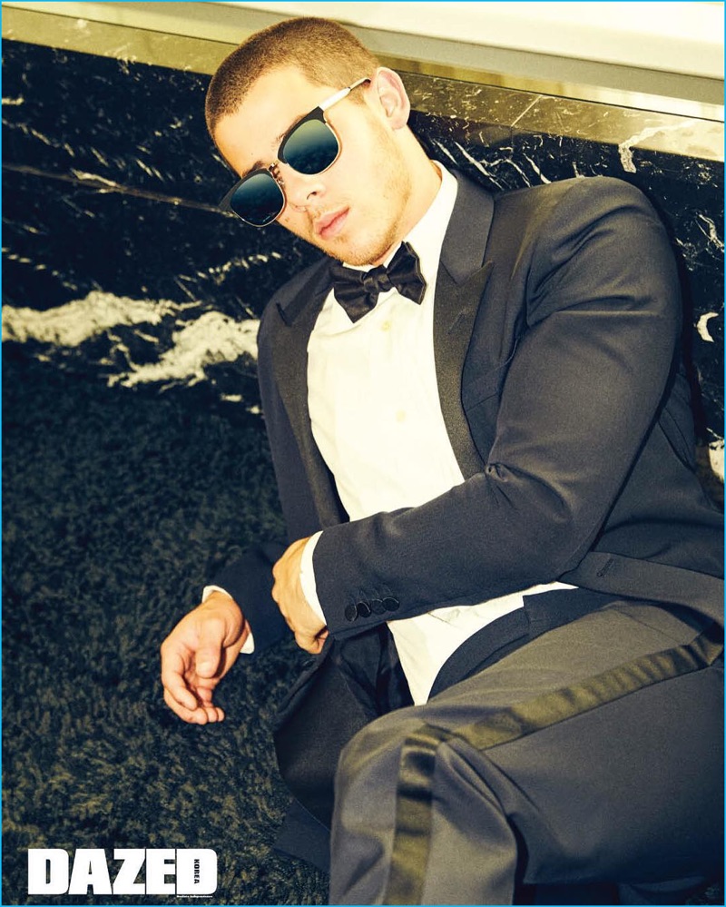 Nick Jonas is suave in a sharp tuxedo and cool sunglasses for Dazed Korea.