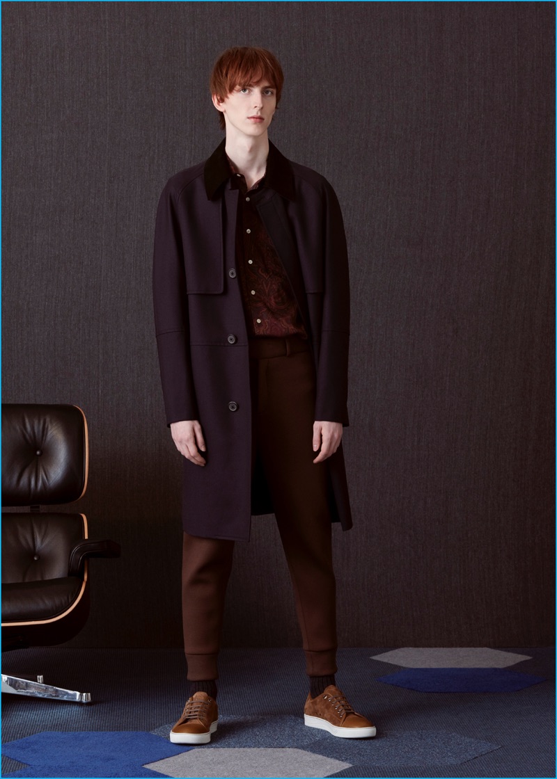 Matthew wears belted overcoat Wooyoungmi, printed shirt Our Legacy, neoprene trousers Neil Barrett, and suede sneakers Lanvin.