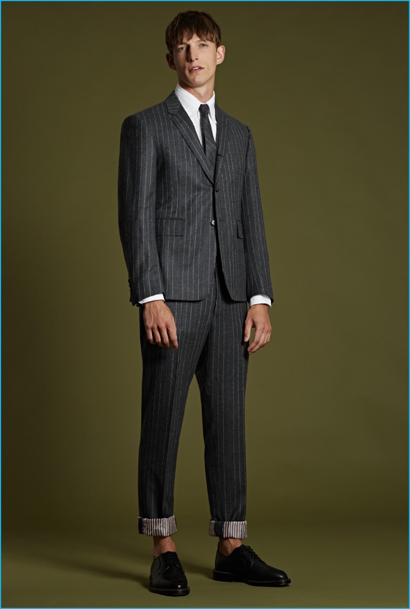 Thom Browne charcoal pinstriped suit, white cotton oxford shirt, grey pinstriped wool tie, and black pebblegrain leather brogues.