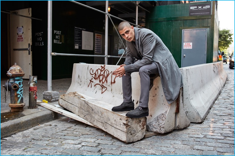 Embracing shades of grey, Micky Ayoub dons a longline coat from Ovadia & Sons.