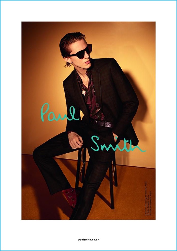 Xavier Buestel fronts Paul Smith's fall-winter 2016 campaign, posing in a check suit and patterned button-down shirt.